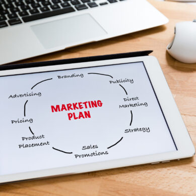 Business office table with table pc presenting marketing planning