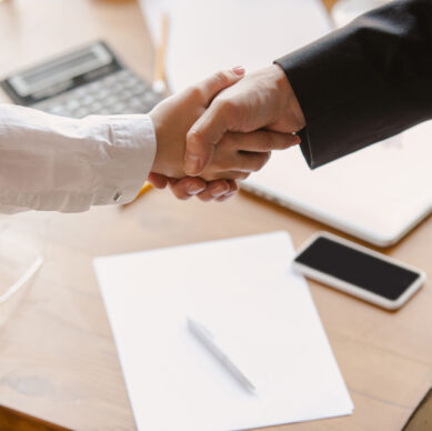 Close up of caucasian human hands, shaking, working in office, business, people