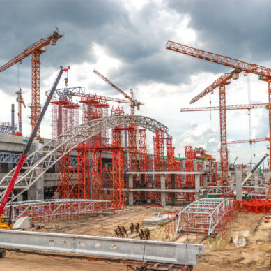 Construction Cranes Working on Expressway and Skytrain Site in A